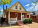 Charming two-story home with brick exterior and inviting front porch with swing at 52 S Washington St, Denver, CO 80209