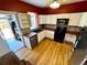 Well-lit kitchen with white cabinets, wood countertops, and updated appliances at 52 S Washington St, Denver, CO 80209
