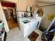 Laundry room with washer, dryer and tiled floors at 52 S Washington St, Denver, CO 80209