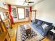Bright living room with a decorative fireplace, ceiling fan, and a comfortable couch at 52 S Washington St, Denver, CO 80209