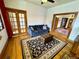 Spacious living room featuring a plush couch, area rug, and wood-framed doorway at 52 S Washington St, Denver, CO 80209