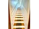 Staircase with white risers and wooden treads at 52 S Washington St, Denver, CO 80209
