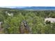 Distant aerial of home with mountain view in the background at 1185 Fawnwood Rd, Monument, CO 80132