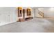 Finished basement with modern storage cabinets and staircase leading to the upper level at 1185 Fawnwood Rd, Monument, CO 80132