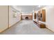 Finished basement area with brick fireplace, custom cabinets, and neutral carpet at 1185 Fawnwood Rd, Monument, CO 80132