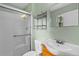 Bathroom with updated shower, sink, and tiled walls at 1185 Fawnwood Rd, Monument, CO 80132