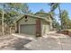 View of two-story home featuring a two-car garage with brick accents at 1185 Fawnwood Rd, Monument, CO 80132