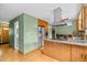 Modern kitchen layout with a stylish island, stainless appliances, and ample cabinetry at 1185 Fawnwood Rd, Monument, CO 80132