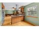 Spacious kitchen with a central island and seamless access to the living area at 1185 Fawnwood Rd, Monument, CO 80132