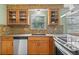 Kitchen with stainless steel appliances, mosaic backsplash and lots of cabinets at 1185 Fawnwood Rd, Monument, CO 80132