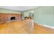 Spacious living room with hardwood floors and brick fireplace at 1185 Fawnwood Rd, Monument, CO 80132