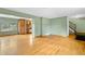 Spacious living room features hardwood floors and open access to the kitchen at 1185 Fawnwood Rd, Monument, CO 80132