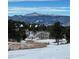 Expansive landscape of snow-covered land and distant mountains at 1185 Fawnwood Rd, Monument, CO 80132