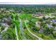 This aerial view showcases the neighborhood green space and nearby walking trails at 15918 E Flora Pl, Aurora, CO 80013