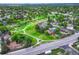 This aerial view shows a lovely neighborhood with mature trees and walking trails at 15918 E Flora Pl, Aurora, CO 80013