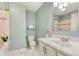 Well-lit bathroom with a shower/tub, vanity with countertop, and tile flooring at 15918 E Flora Pl, Aurora, CO 80013