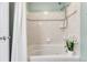 Bathroom featuring a jacuzzi tub and shower with white tile and a showerhead at 15918 E Flora Pl, Aurora, CO 80013