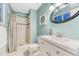Charming bathroom with a tiled shower, elegant vanity, and stylish fixtures at 15918 E Flora Pl, Aurora, CO 80013