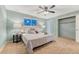 Relaxing bedroom featuring a queen bed with decorative pillows and coordinated side tables at 15918 E Flora Pl, Aurora, CO 80013