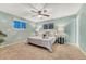 Cozy bedroom featuring a comfortable bed, stylish side tables, and ample natural light at 15918 E Flora Pl, Aurora, CO 80013