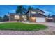 Charming two-story home boasts a well-maintained lawn, brick accents, and an attached two-car garage at 15918 E Flora Pl, Aurora, CO 80013