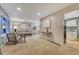 Inviting living room with neutral tones, plush carpeting, and ample natural light through a large window at 15918 E Flora Pl, Aurora, CO 80013