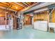 Unfinished basement with laundry area, water heater, and furnace at 2180 S Flower Way, Lakewood, CO 80227
