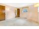 Bedroom features an ensuite bathroom and window bringing in light at 2180 S Flower Way, Lakewood, CO 80227