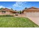 Inviting single-story home with a well-maintained lawn and brick exterior at 2180 S Flower Way, Lakewood, CO 80227