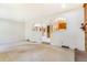 Open living area with view of the kitchen and fireplace at 2180 S Flower Way, Lakewood, CO 80227