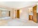 Comfortable main bedroom with mirrored closet doors and ensuite bathroom at 2180 S Flower Way, Lakewood, CO 80227