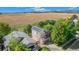 Aerial view of home with solar panels on the roof and open fields in the distance at 1624 Westin Dr, Erie, CO 80516