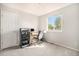 Comfortable room featuring a modern desk setup with a large window offering outside view at 1624 Westin Dr, Erie, CO 80516