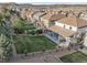 Aerial view of the backyard featuring a covered patio and well-maintained landscaping at 2198 Broadleaf Loop, Castle Rock, CO 80109