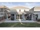Backyard featuring a covered patio, hot tub, and outdoor seating area perfect for relaxation at 2198 Broadleaf Loop, Castle Rock, CO 80109