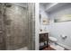 Elegant bathroom with a glass-enclosed shower and dark wood vanity at 2198 Broadleaf Loop, Castle Rock, CO 80109