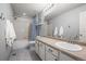 Bathroom features a tub-shower, white vanity, and tile flooring, perfect for everyday convenience at 2198 Broadleaf Loop, Castle Rock, CO 80109