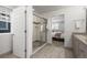 Well-lit bathroom featuring a glass-enclosed shower, tile floor, and easy access to the bedroom at 2198 Broadleaf Loop, Castle Rock, CO 80109