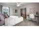 Cozy bedroom with carpet, a closet with organizers and a desk area with a white chair at 2198 Broadleaf Loop, Castle Rock, CO 80109
