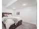 Bedroom with a dark brown sleigh bed and neutral decor at 2198 Broadleaf Loop, Castle Rock, CO 80109