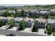 Aerial view of a gray two-story home with a basketball hoop in a suburban neighborhood at 2198 Broadleaf Loop, Castle Rock, CO 80109