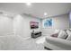 Bright living room showcasing a sofa, television, and modern decor at 2198 Broadleaf Loop, Castle Rock, CO 80109