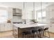Modern kitchen featuring a center island with bar stool seating and stainless steel appliances at 14247 Beebalm Loop, Parker, CO 80134