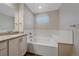 Bathroom with granite countertop, tub and single vanity at 12255 Hazel Spruce Ct, Parker, CO 80134
