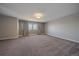 Well-lit bedroom with neutral walls, carpet and window coverings at 12255 Hazel Spruce Ct, Parker, CO 80134