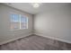Bright bedroom with neutral paint, carpet and window coverings at 12255 Hazel Spruce Ct, Parker, CO 80134