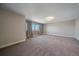 Bright bedroom featuring neutral walls, carpet, and window coverings at 12255 Hazel Spruce Ct, Parker, CO 80134