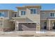 Modern two-story townhome with attached garage and landscaping at 12255 Hazel Spruce Ct, Parker, CO 80134