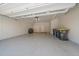 Attached garage with epoxy flooring and storage at 12255 Hazel Spruce Ct, Parker, CO 80134