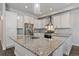 Modern kitchen with granite countertops and stainless steel appliances at 12255 Hazel Spruce Ct, Parker, CO 80134